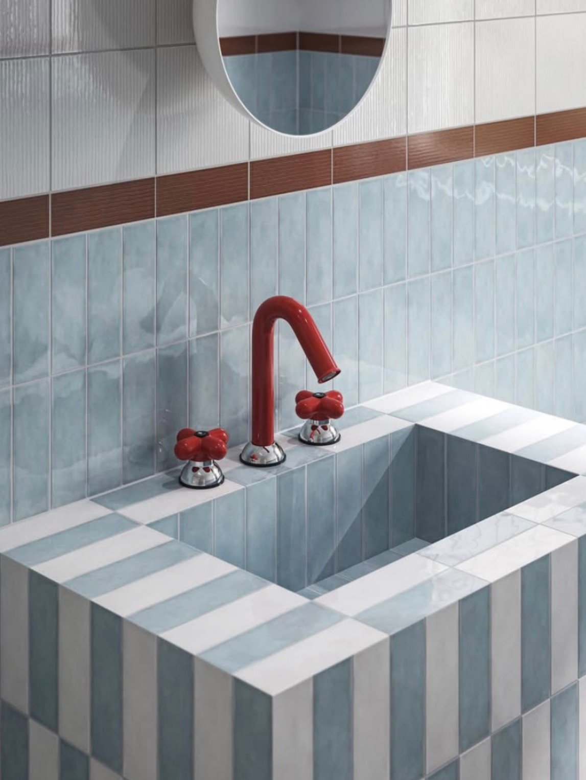 Striped blue basin with red tap